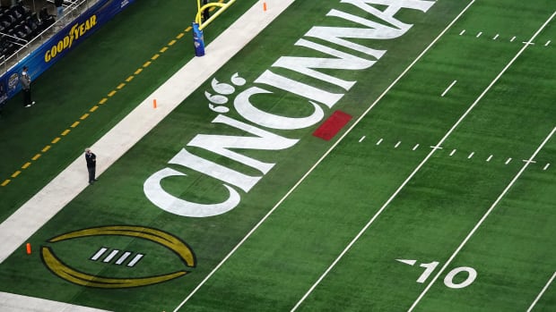 The Cincinnati Bearcats logo featured in the middle of the field ahead of the College Football Playoff semifinal game between the Alabama Crimson Tide and the Cincinnati Bearcats at the 86th Cotton Bowl Classic, Friday, Dec. 31, 2021, at AT&T Stadium in Arlington, Texas.